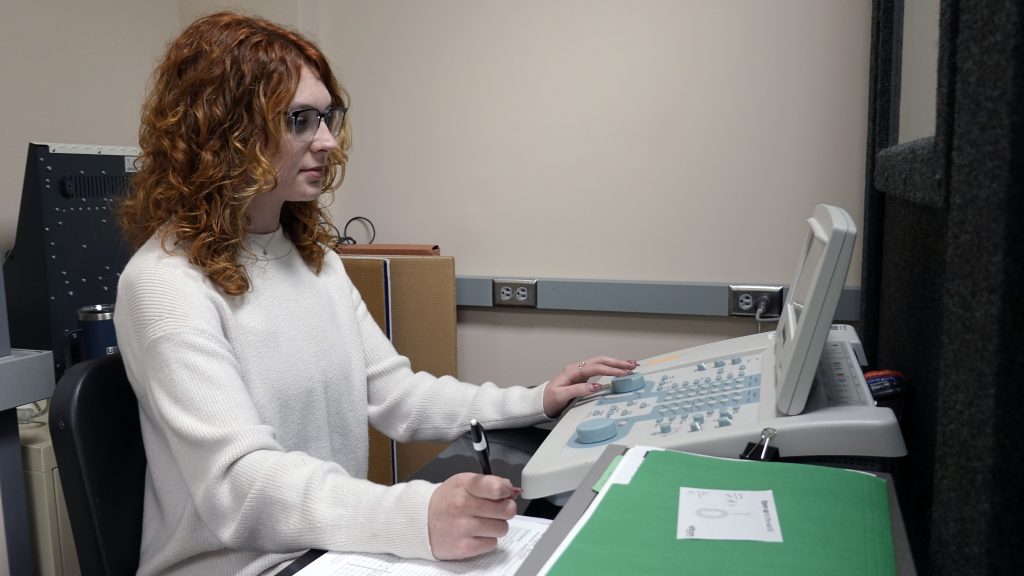 McNeill student audiology conducting hearing test